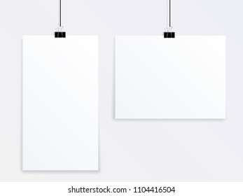 Mockup vector of two posters of different sizes hanging on a gray wall on office clothespins.