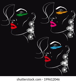 Models in earrings on black background 