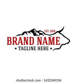 Moder cow and mountains logo