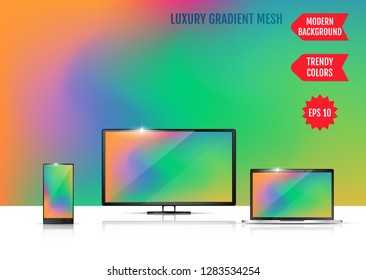Modern abstract background. Colors transition concept. Gradient mesh. Trendy colored Surface. An example of the use of the proposed background on the screen of a laptop, smartphone and TV