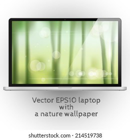 Modern abstract black and silver laptop with a blurred nature background vector illustration