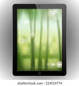 Modern abstract black tablet with a blurred nature background vector illustration