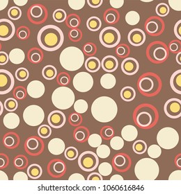 Modern Abstract Confetti Background In Brown. Seamless colorful doughnuts and dots pattern. Stock vector festive fun repeat for your design projects, textile, wrapping, wallpaper, web.