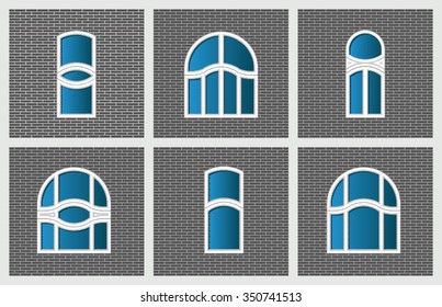 modern arched windows on gray brick wall