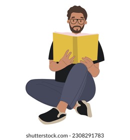 A modern bearded man in glasses reading a book.