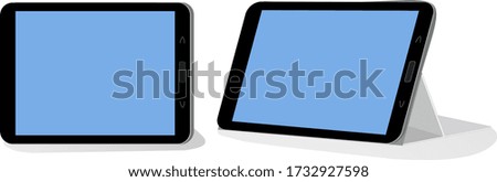 Modern black tablet computer on a white background in anphas and side view. A tablet PC and a screen for introducing your advertising.  