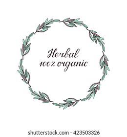Modern brush lettering. Handwrittern words - 100% organic, herbal. Ink hand lettering. Circle frame made of branches with leaves.