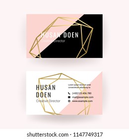 Modern business card with geometric gold shape and luxury style texture.