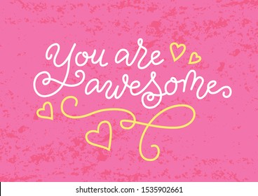 Modern calligraphy lettering of You are awesome in white and yellow on pink textured backdrop for decoration, motivation, present, gift tag, greeting card, valentine, birthday, scrapbooking