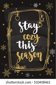 Modern calligraphy style winter quote with decorative golden frame and snowflakes. Hand drawn design elements and winter seasons phrase. Vector illustration on chalkboard background.