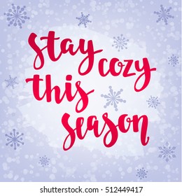Modern calligraphy style winter quote with snowflakes. Handwritten lettering season phrase. Vector illustration for your design on light blue background.