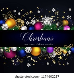 Modern Christmas composition with black background, golden decor and coloful balls