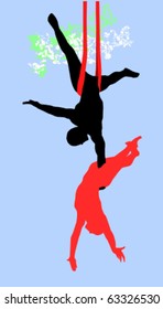 Modern circus acrobats: a man holding a woman in mid-air