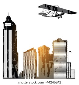 Modern city with sckyscrapes and vintage glider silhouette