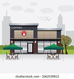 Modern coffee shop with garden in city.