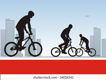 Modern composition with bicyclists. In the foreground three boys on bicycles. On a distance shot a city landscape.