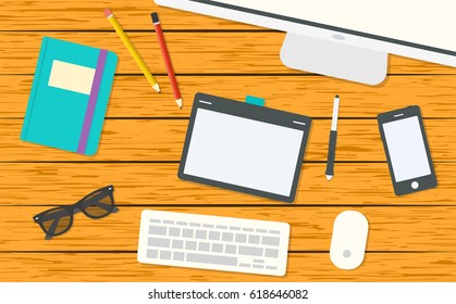 Modern designer workspace with computer. Top view on wooden background