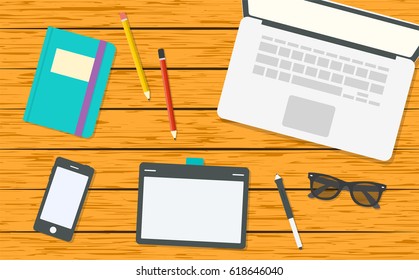 Modern designer workspace with laptop. Top view on wooden background