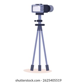 Modern digital camera is standing on a tripod, ready to take a photo or video