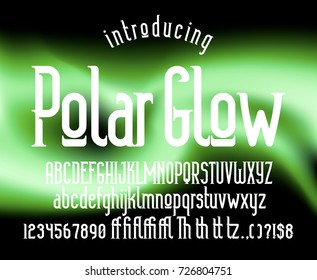 Modern display condensed serif font. Minimalistic typeface on the abstract polar glow background. Alphabet character set, numerals & punctuations, accents (multilingual characters)