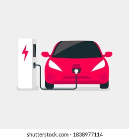 Modern electric car charges on an electric vehicle EV charging station point.