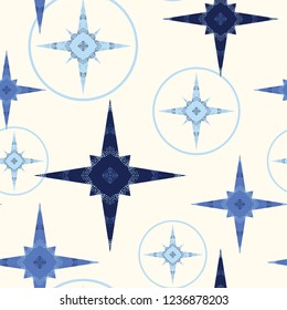 Modern holiday seamless pattern with retro flair. Blue  stars and ornaments on a light ivory background. Great for gift wrapping paper, textiles, home decor, gift boxes, textiles and tree skirts.
