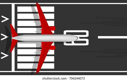 A modern jet passenger white plane with red wings on the runway. View from above. A well-designed image with a mass of small details. Airport marking. Copy space.