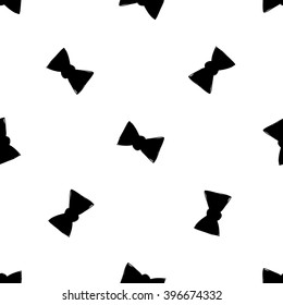 Modern kids b&w seamless pattern with bow tie. Hand drawn graphic with black cute minimalistic scandinavian cartoon elements on white background
