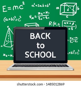 Modern laptop with blank screen on table in classroom