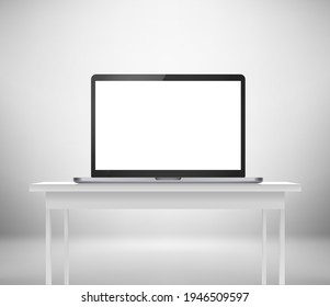 Modern laptop with blank screen on the table. Work place template 