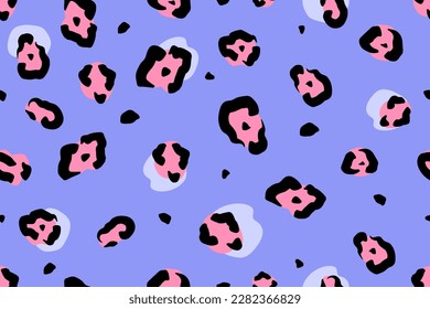 Modern leopard seamless pattern. Vector illustration. Multicolored wild cat print on purple backdrop. Jaguar, leopard and cheetah fur.