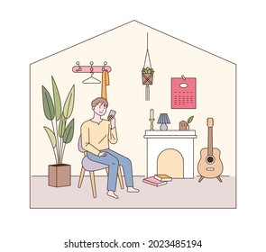 Modern living room interior. A man is sitting in a living room with a fireplace. outline simple vector illustration.