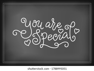 Modern mono line calligraphy lettering of You are special in white with hearts on chalkboard background for decoration, poster, postcard, greeting card, gift tag, label, logo, sign, packaging, present