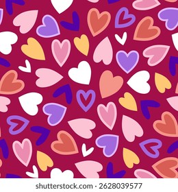 Modern multicolored hearts in seamless pattern on red background