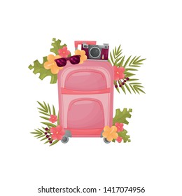 Modern pink suitcase with attributes for travel. Vector illustration on white background.