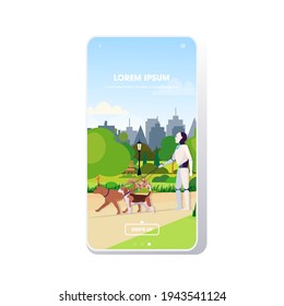 modern robot walking with dogs artificial intelligence technology concept public park cityscape background smartphone screen mobile app copy space full length