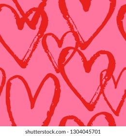 Modern seamless pattern with hand drawn hearts in red on pink background.