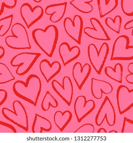 Modern seamless pattern with hand drawn hearts in red on pink background.
