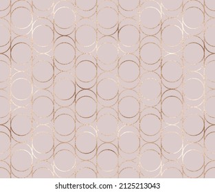 Modern seamless pattern with rose gold geometric shapes.