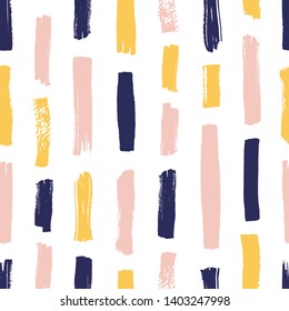 Modern seamless pattern with yellow, pink, blue brush strokes on white background. Creative backdrop with vertical paint traces or smears. Artistic vector illustration for textile print, wallpaper.