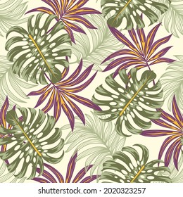 A modern seamless tropical pattern with bright plants and leaves on a beige background. Vector design. Jungle print. Floral background.  Exotic tropics. Summer.