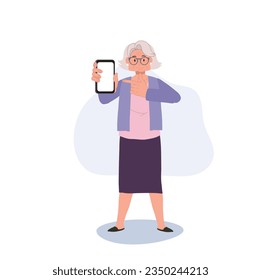 Modern Senior with Technology concept. Elderly Woman Pointing Finger at Smartphone. Active senior Using Smartphone for Online Interaction