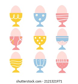 Modern set of 9 easter eggs in eggcups with different ornaments. Good for greeting cards, banners, invitations, flyers.