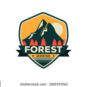 Modern shield forest camp badge. Vector graphic mountaine camping logo. Exploration camp, tourism extreme sport club emblem, logo design. Wild travel sticker. 