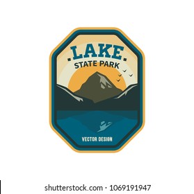 Modern shield lake camp badge. Vector graphic forest camping logo. Exploration  tourism emblem, logo design. Lake park travel sticker. 