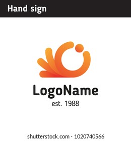 modern sign in the form of a hand holding a ball