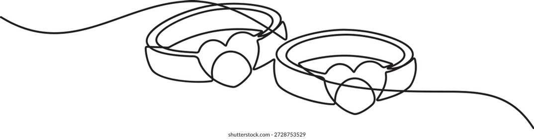 Moderno estilo de contorno limpio del anillo de bodas de una sola línea que representa un par de bandas a juego coronadas con Formas de corazón para un tema de boda romántico