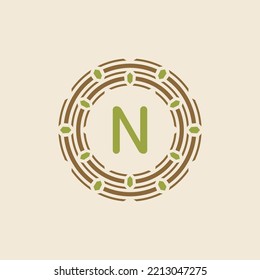 modern and sophisticated letter N nest logo. simple and memorable nest leaf tech circle emblem.