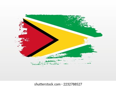Modern style brush painted splash flag of Guyana with solid background