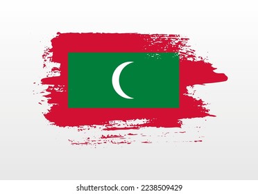 Modern style brush painted splash flag of Maldives with solid background